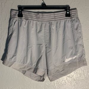 Light grey Nike shorts, size L
